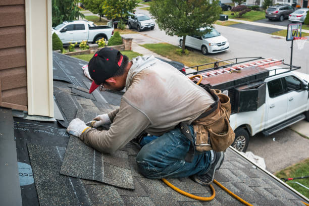 Professional Roofing technician working in Lake City, PA